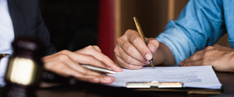 Business professionals signing contracts | CNA Insurance