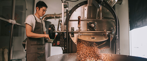 Coffee roaster working in factory