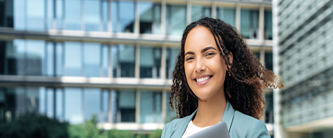 Woman standing in front of an office building