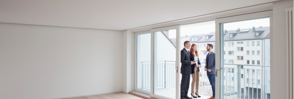 Real Estate Agent Showing Clients a Home