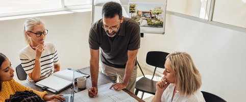 Architects going over blueprints at an office