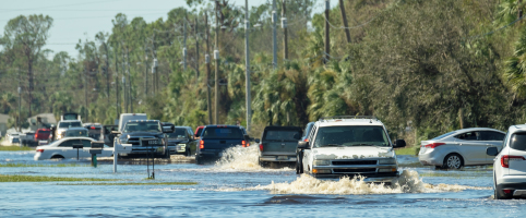 Cars on the road in flood waters