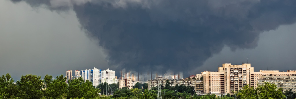 Tornado about to touch down over a city