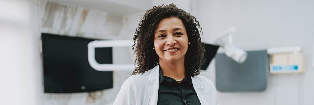 Dentist standing in an office