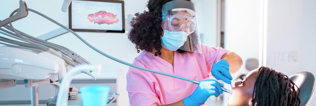 Dentist cleaning a patient's teeth