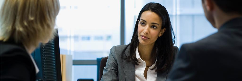 Woman at desk working | CNA Insurance