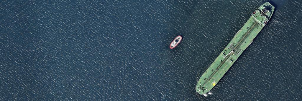 Aerial view of a boat and oil tanker in the ocean