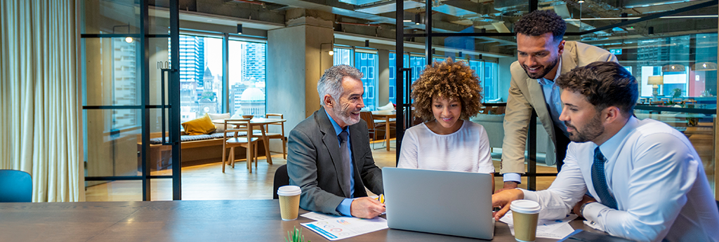 Colleagues working together at a desk