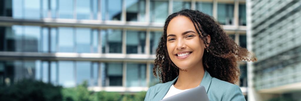 Woman standing in front of an office building