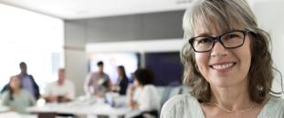 Businesswoman in team meeting | CNA Insurance