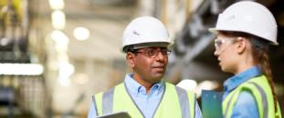 Two engineers working on site