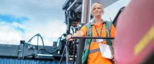 Construction worker standing on a cargo ship