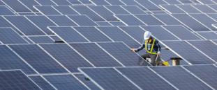 Construction worker working on installing solar panels