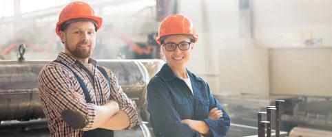 Two engineers working in a factory