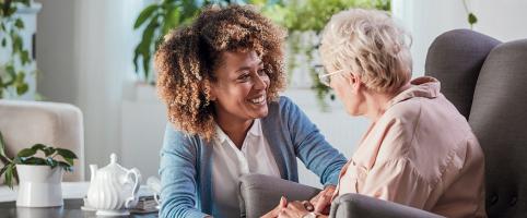 Nurse working with an elderly patient in an office